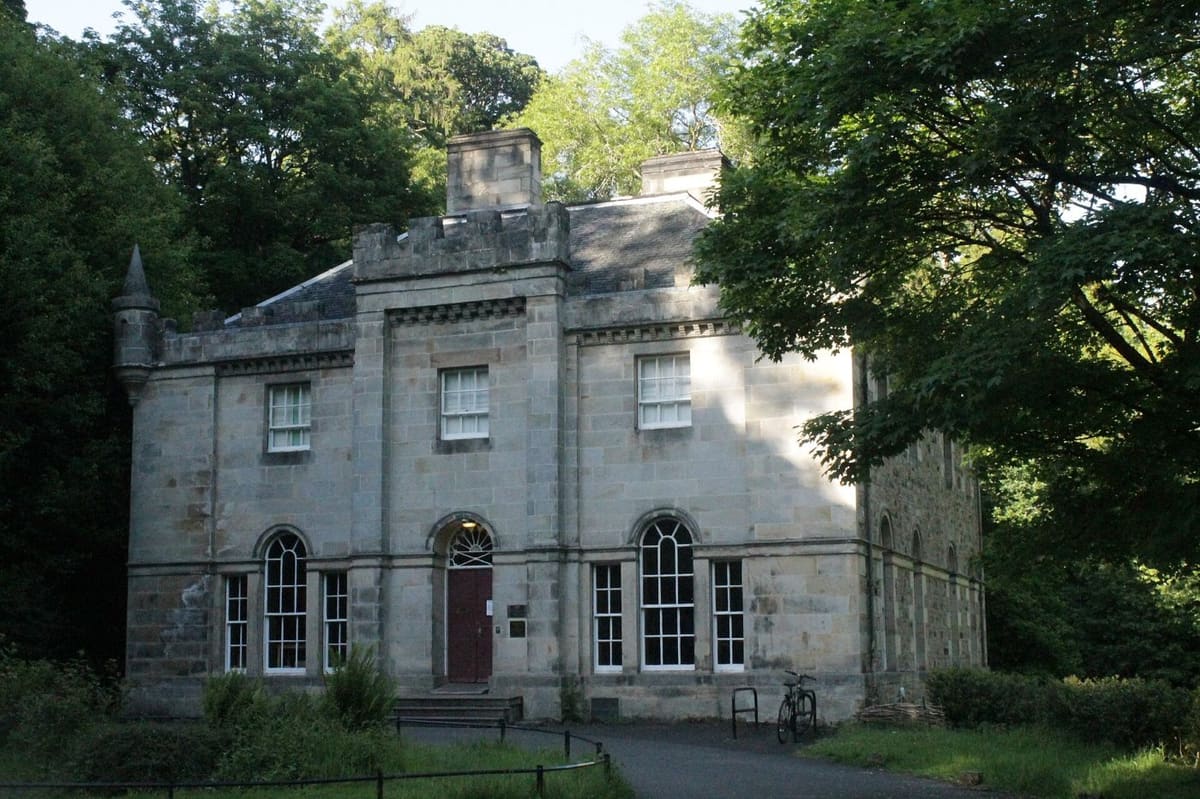 Hermitage House surrounded by woodland in the Hermitage of Braid nature reserve, Morningside