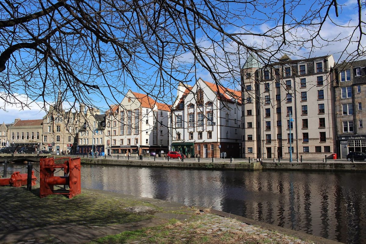 The Shore in Leith, Edinburgh, with historic buildings reflected in the Water of Leith